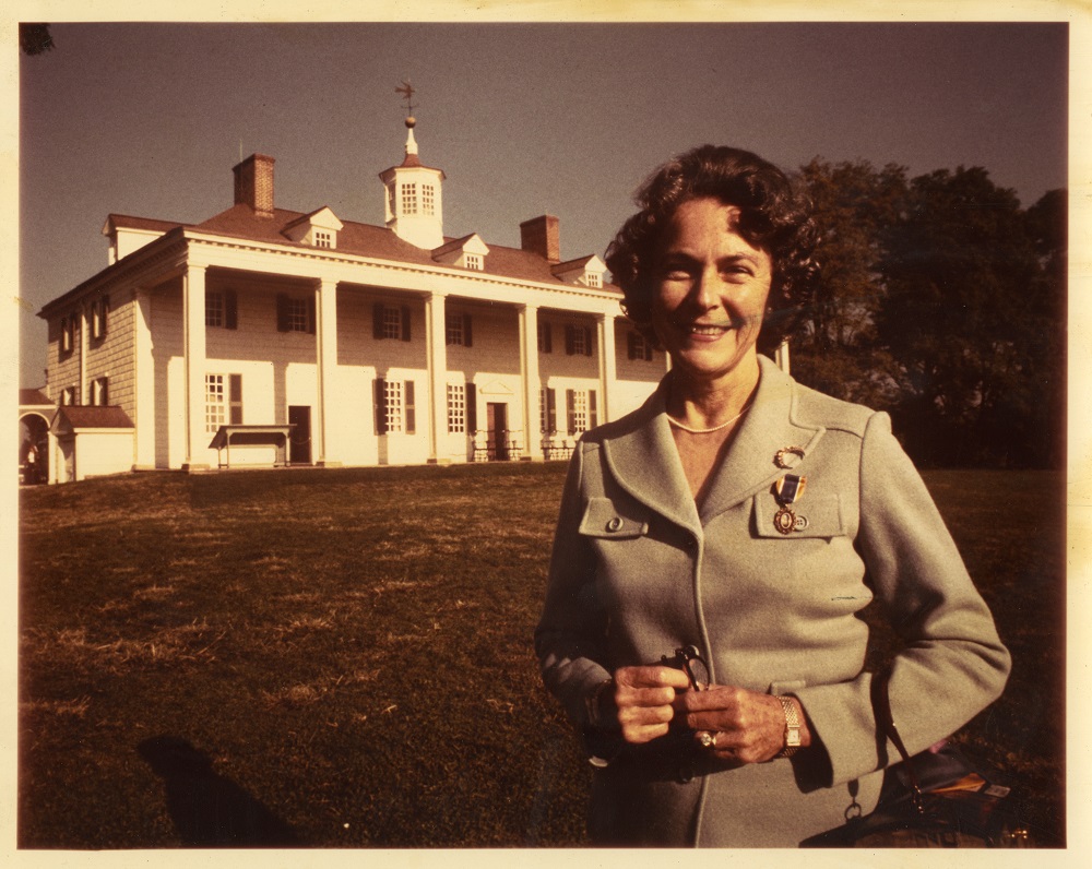 Mary Call Collins standing in front of Mount Vernon while serving as Vice Regent for Florida to the Mount Vernon Ladies Association, 1963. 