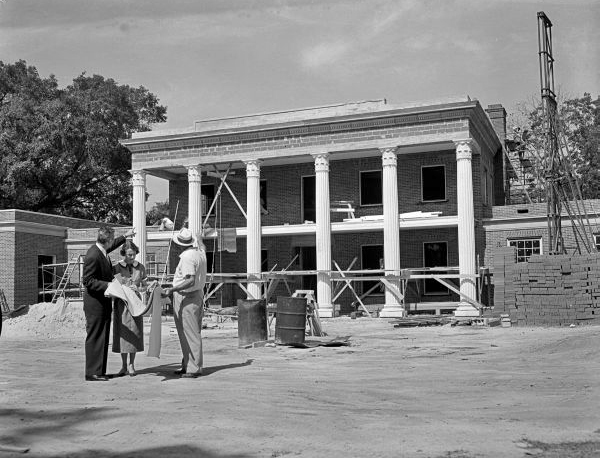 LeRoy and Mary Call Collins with a site foreman during construction on the new Governor's Mansion, June 1956. 